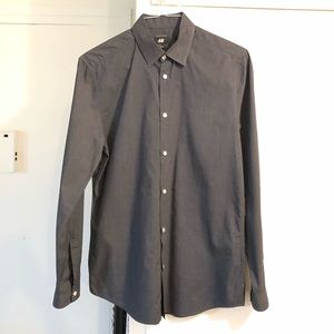 A gray long sleeve button up H&M tee shirt